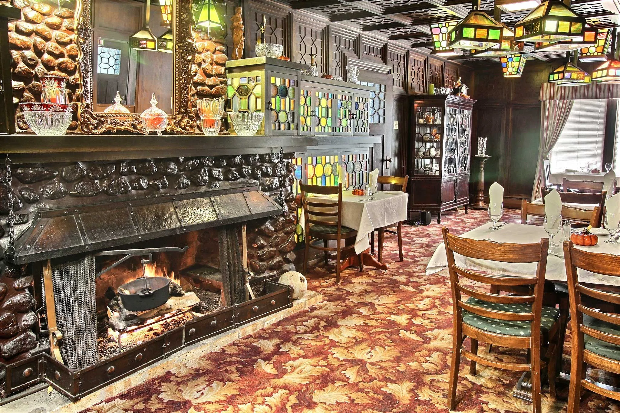 Dining room beside the river-rock fireplace