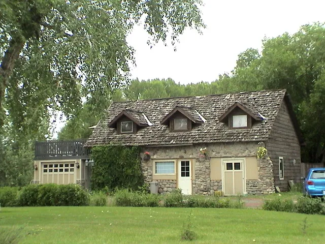 The stone guest house in summer