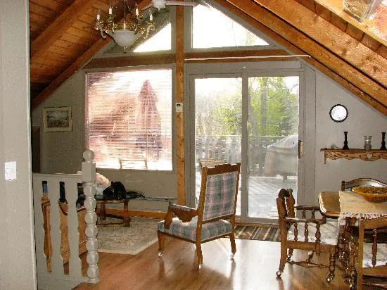 Upstairs suite sitting room under a timber ceiling