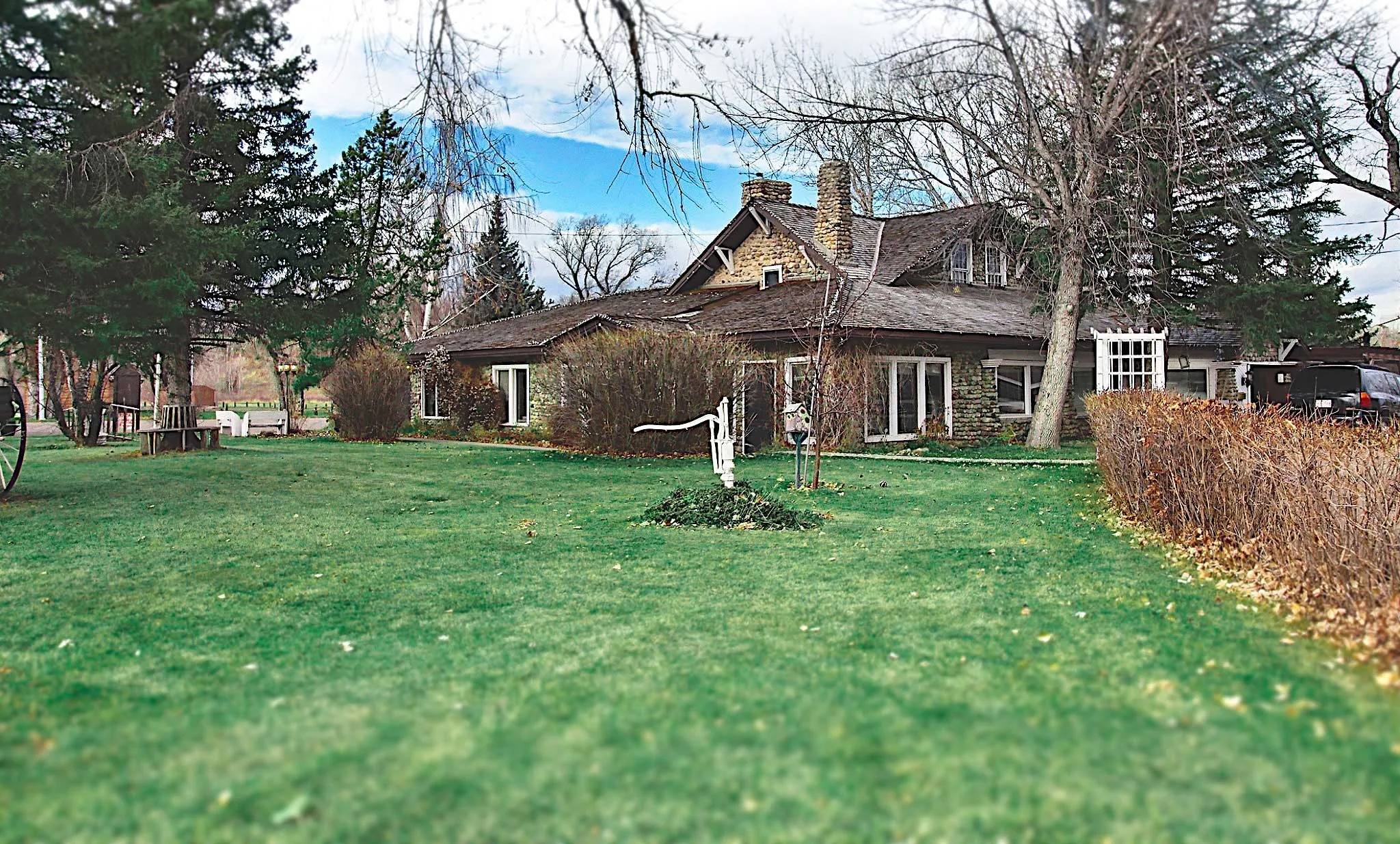 The Cobblestone Manor and its front lawn in Cardston, Alberta